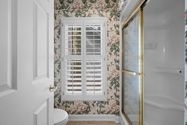 9175 Spring Branch Ct, North Charleston, SC 29406 - bathroom with wallpapered walls, a stall shower, plenty of natural light, and tile patterned floors