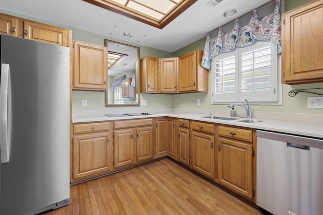 9175 Spring Branch Ct, North Charleston, SC 29406 - kitchen with stainless steel appliances, light countertops, and light wood finished floors