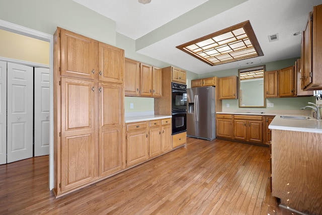 9175 Spring Branch Ct, North Charleston, SC 29406 - kitchen featuring stainless steel fridge with ice dispenser, light wood finished floors, and light countertops