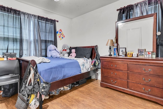 bedroom with light hardwood / wood-style floors