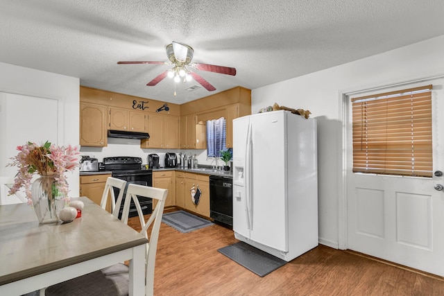 kitchen featuring ceiling fan, light hardwood / wood-style floors, a textured ceiling, and black appliances