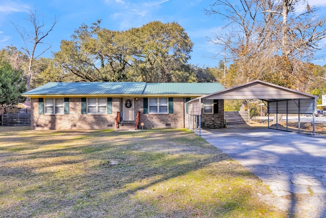 ranch-style house featuring a front yard and a carport