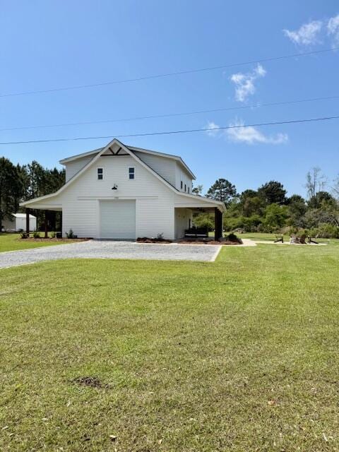 view of home's exterior featuring a garage, a yard, and driveway