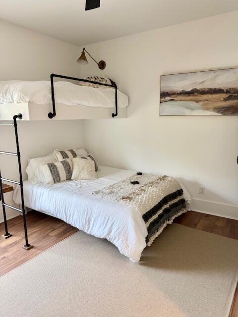 bedroom featuring wood finished floors and a ceiling fan