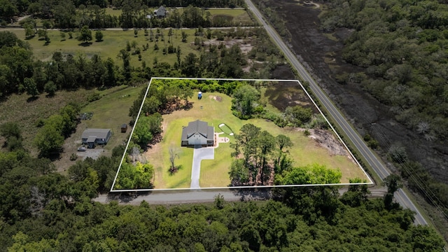 aerial view of property and surrounding area with property parcel outlined
