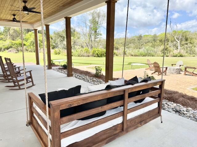 view of patio with ceiling fan and view of golf course