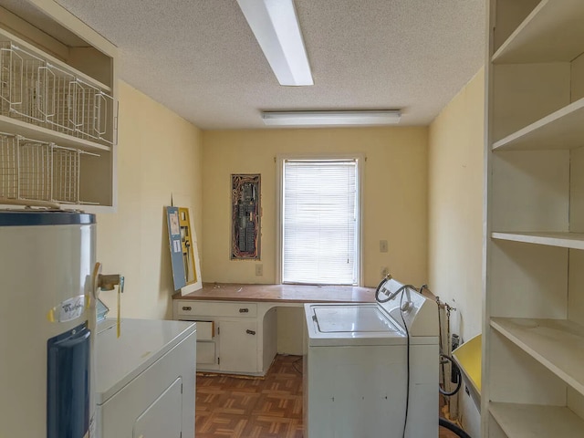 clothes washing area with a textured ceiling, dark parquet flooring, water heater, and washing machine and clothes dryer