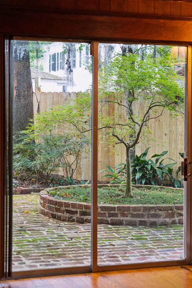 doorway to outside with hardwood / wood-style floors