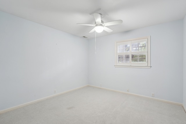 carpeted empty room featuring ceiling fan