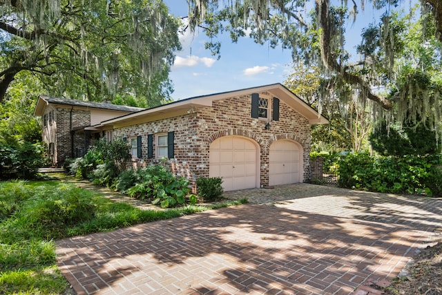 view of property exterior with a garage