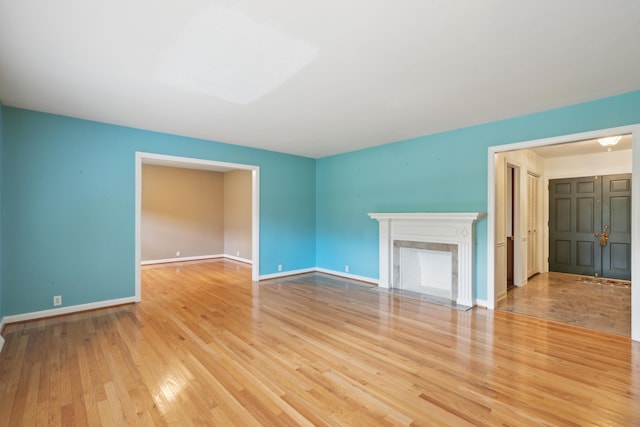 spare room featuring light hardwood / wood-style flooring