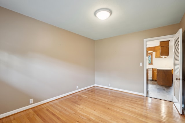 unfurnished bedroom with light wood-type flooring