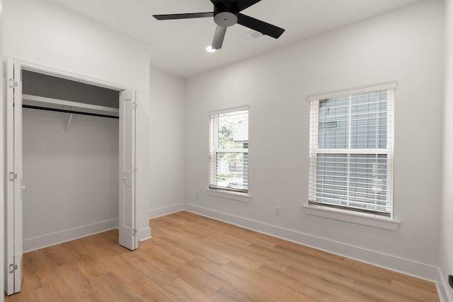 866 Tripe St, Charleston, SC 29407 - unfurnished bedroom with light wood finished floors, baseboards, a closet, and a ceiling fan