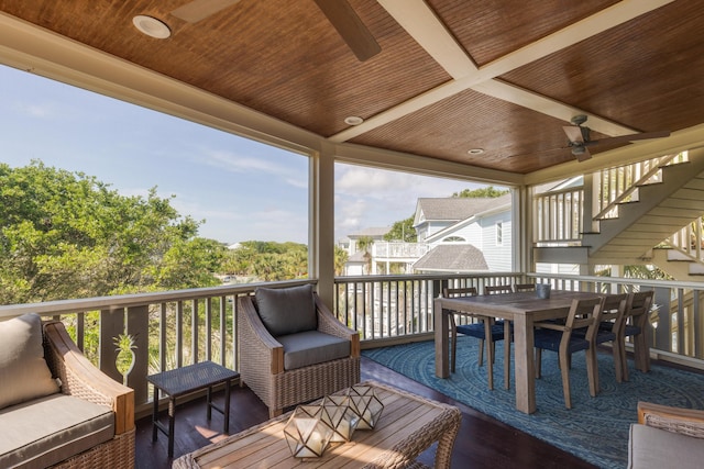 deck with ceiling fan, stairs, outdoor lounge area, and outdoor dining area