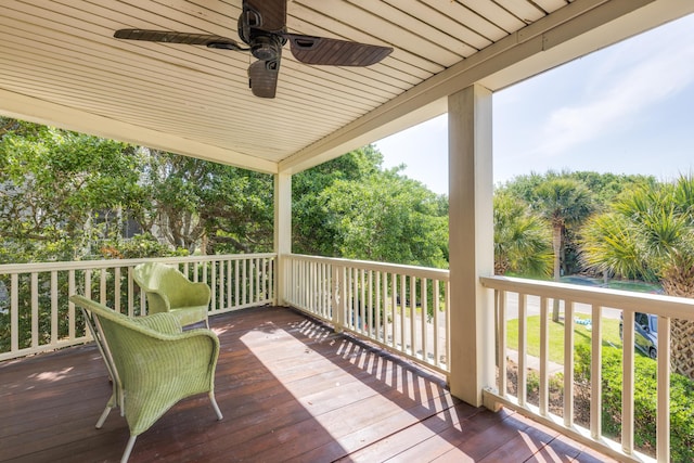 wooden terrace featuring ceiling fan
