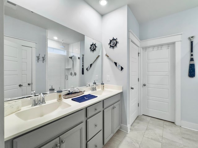 bathroom with an enclosed shower and vanity