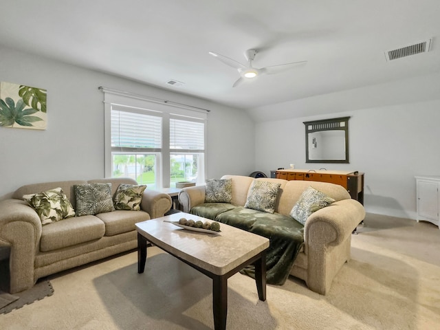 carpeted living room featuring ceiling fan