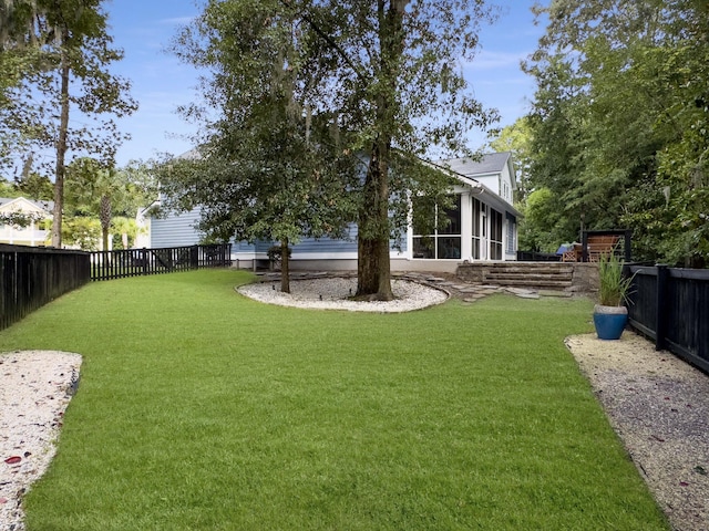 view of yard featuring a sunroom