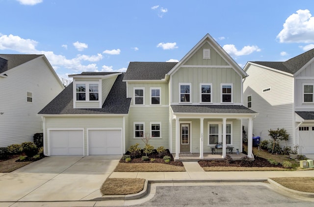 traditional home with a porch, an attached garage, driveway, roof with shingles, and board and batten siding