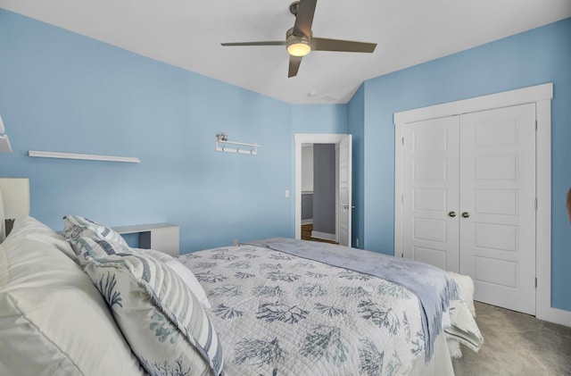 carpeted bedroom with a closet and ceiling fan
