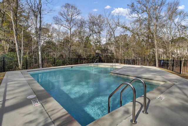 community pool featuring fence