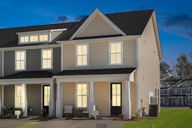 view of front of home featuring cooling unit and a porch