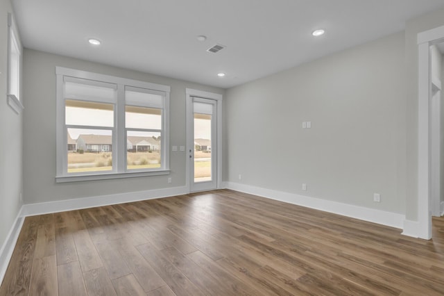 empty room with wood-type flooring