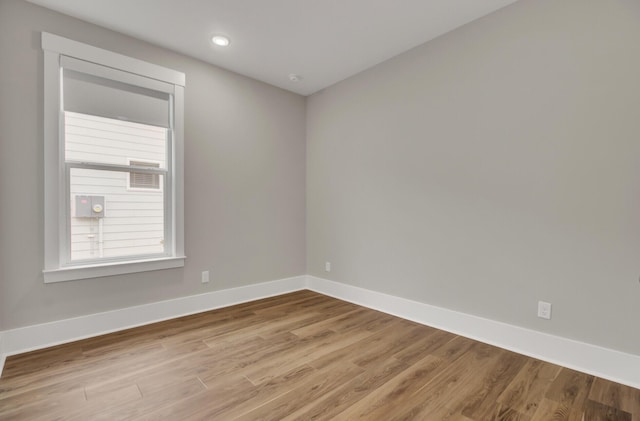 empty room with light hardwood / wood-style flooring