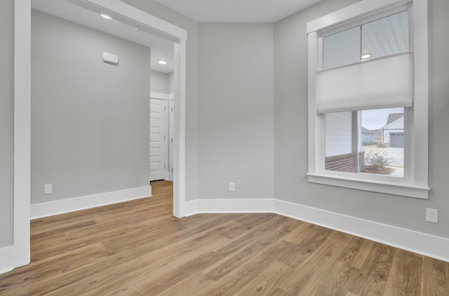 spare room featuring light hardwood / wood-style floors