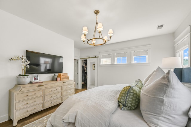 1713 Banning St, Mount Pleasant, SC 29466 - bedroom with a chandelier and dark wood-type flooring
