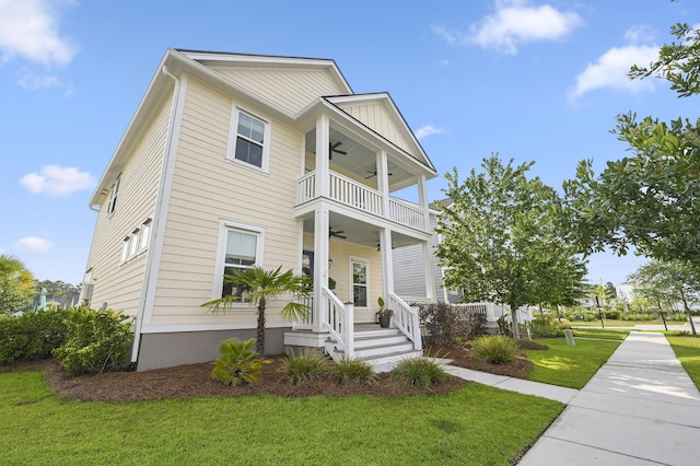 1713 Banning St, Mount Pleasant, SC 29466 - view of front facade featuring a ceiling fan, a balcony, and a front yard