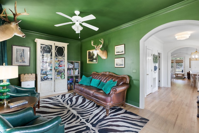 601 King Haven Ln, Johns Island, SC 29455 - living room featuring arched walkways, a ceiling fan, wood finished floors, crown molding, and baseboards