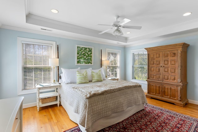 601 King Haven Ln, Johns Island, SC 29455 - bedroom with a raised ceiling, light wood-style flooring, ornamental molding, baseboards, and recessed lighting