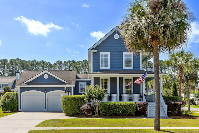 601 King Haven Ln, Johns Island, SC 29455 - view of front of property featuring a porch, a garage, concrete driveway, and a front lawn