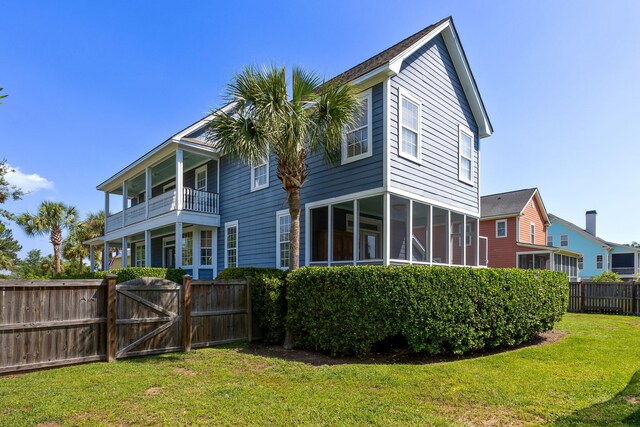 601 King Haven Ln, Johns Island, SC 29455 - rear view of house with a gate and a sunroom