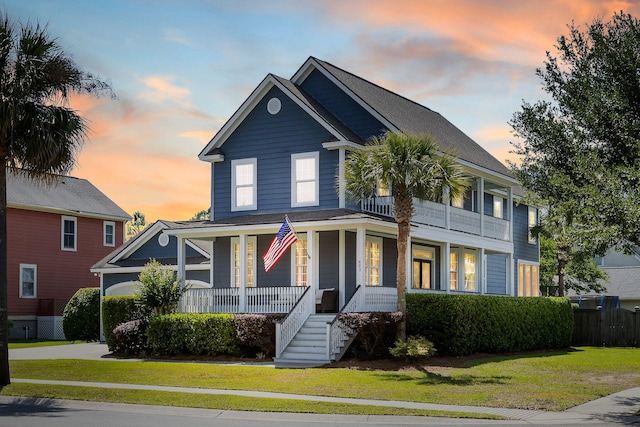 601 King Haven Ln, Johns Island, SC 29455 - view of front of home featuring a porch, a lawn, stairs, concrete driveway, and a balcony