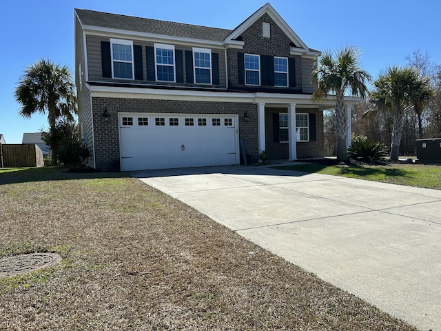 view of front of home with concrete driveway, brick siding, a front lawn, and an attached garage