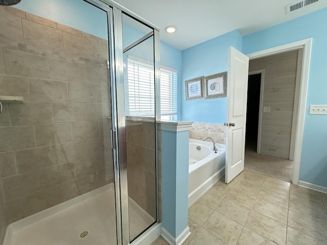 full bathroom with visible vents, baseboards, tile patterned flooring, a shower stall, and a bath