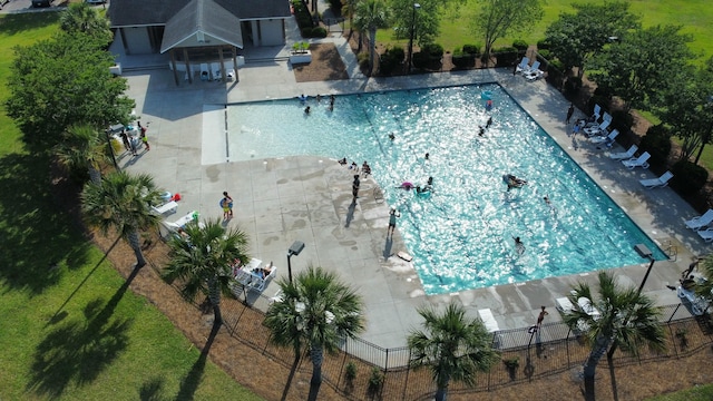 community pool featuring a patio area and fence