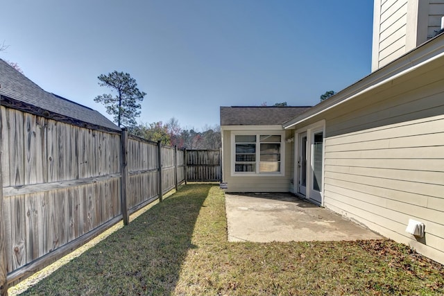 view of yard with a patio and a fenced backyard