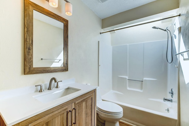 full bathroom featuring bathtub / shower combination, toilet, vanity, and a textured ceiling