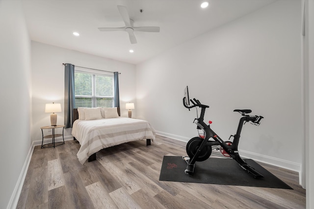 bedroom with hardwood / wood-style flooring and ceiling fan