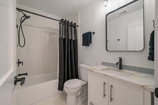 full bathroom featuring vanity, shower / tub combo with curtain, and toilet