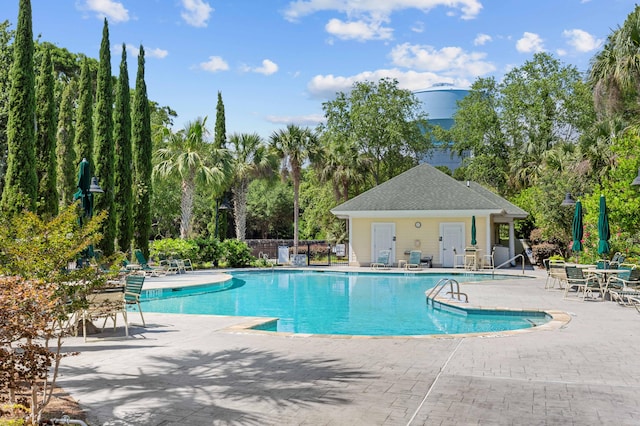 view of swimming pool featuring a patio area