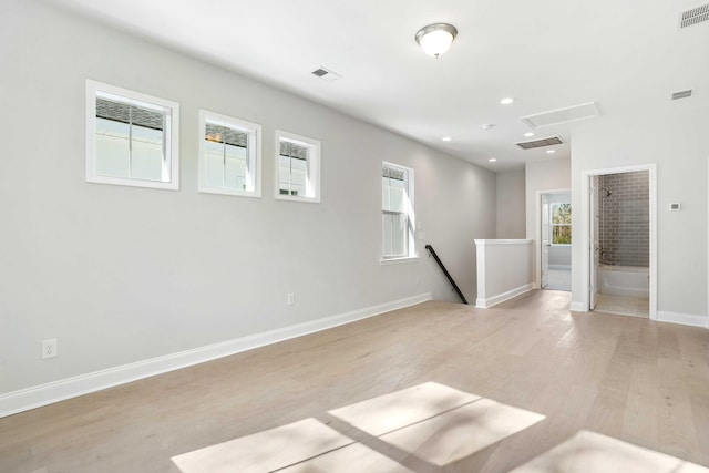 unfurnished room with light hardwood / wood-style floors