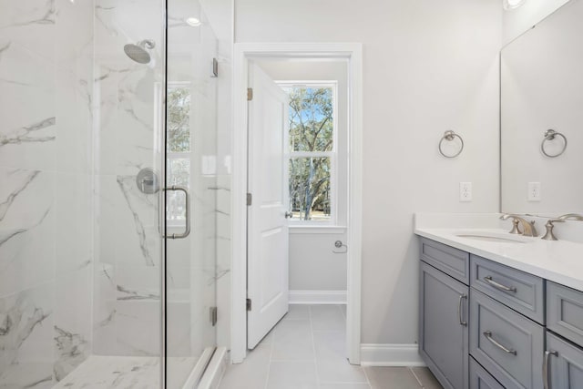 bathroom featuring vanity, tile patterned floors, and a shower with door