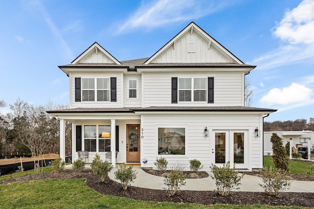 view of front facade with a front yard and covered porch