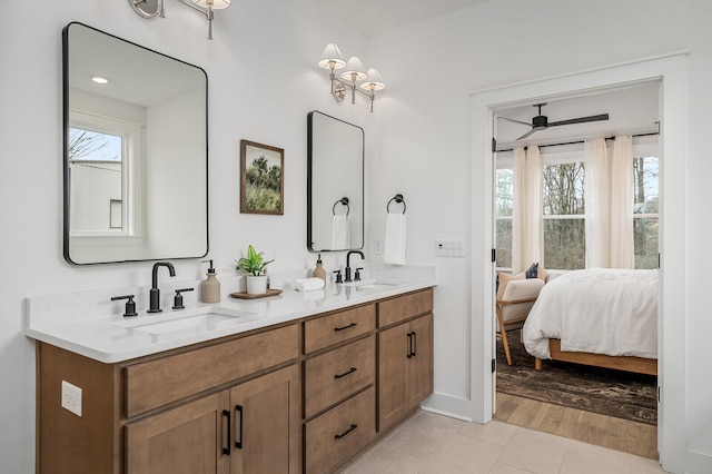 bathroom with vanity, ceiling fan, and wood-type flooring