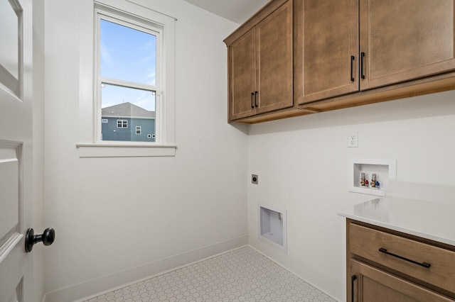 laundry area featuring hookup for a washing machine, cabinets, and electric dryer hookup