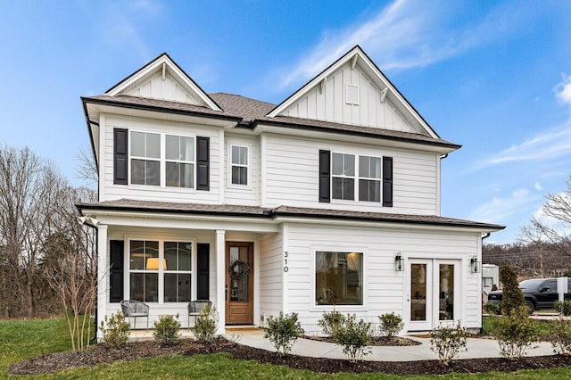 view of front of property featuring a porch, board and batten siding, and a shingled roof